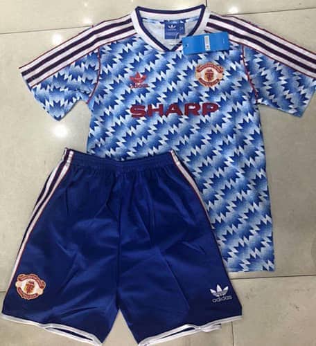 Kids football jersey and shorts set on display